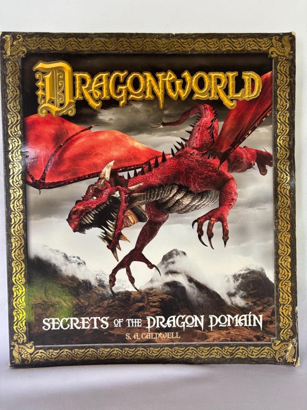 DRAGONWORLD “SECRETS OF THE DRAGON DOMAIN’Dragonworld -PAPERBACK BOOK -2011